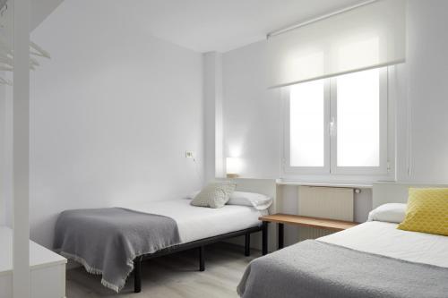 A bed or beds in a room at Always Easy I Arroka