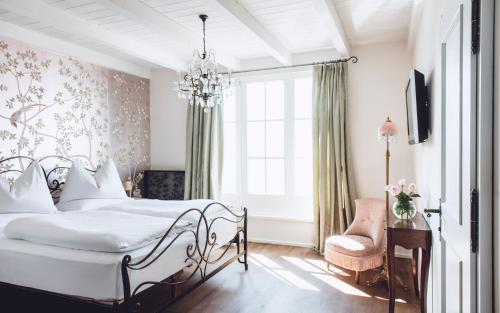 Un ou plusieurs lits dans un hébergement de l'établissement Relais & Chateaux Hotel Castel Fragsburg