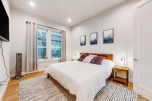 a bedroom with a large bed and a window at In the Heights in Houston