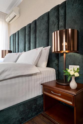 Postel nebo postele na pokoji v ubytování Greguar Hotel by UHM