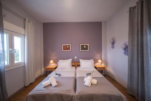 A bed or beds in a room at Mare Nostrum Apartments by Hotelius