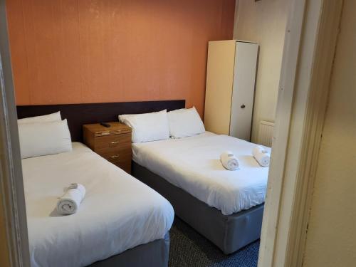 Ένα ή περισσότερα κρεβάτια σε δωμάτιο στο Tulip Hotel Blackpool