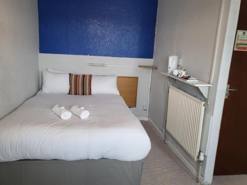 Ένα ή περισσότερα κρεβάτια σε δωμάτιο στο Tulip Hotel Blackpool