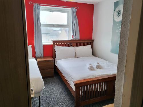 Ένα ή περισσότερα κρεβάτια σε δωμάτιο στο Tulip Hotel Blackpool
