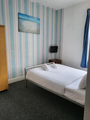 Ένα ή περισσότερα κρεβάτια σε δωμάτιο στο Tulip Hotel Blackpool