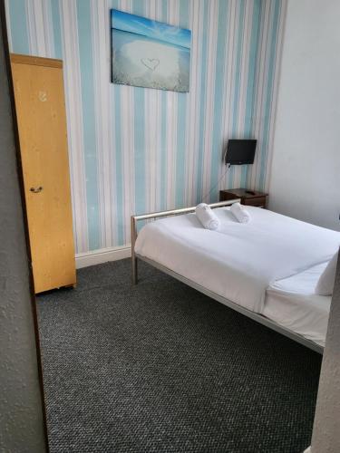 Ένα ή περισσότερα κρεβάτια σε δωμάτιο στο Tulip Hotel Blackpool