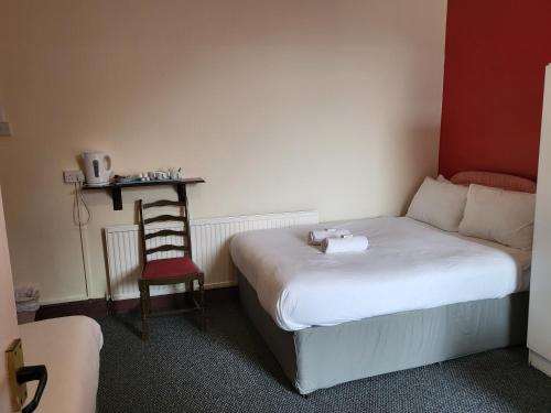 Ένα ή περισσότερα κρεβάτια σε δωμάτιο στο Tulip Hotel Blackpool