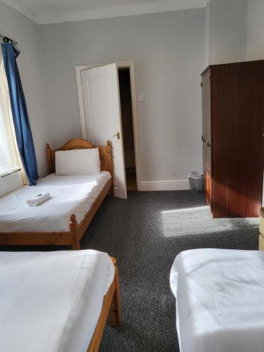 Ένα ή περισσότερα κρεβάτια σε δωμάτιο στο Tulip Hotel Blackpool