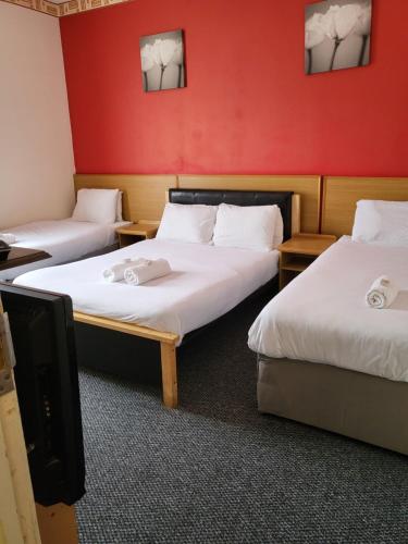 Ένα ή περισσότερα κρεβάτια σε δωμάτιο στο Tulip Hotel Blackpool