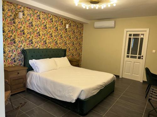 Cama o camas de una habitación en The Red Farm Relais & Spa