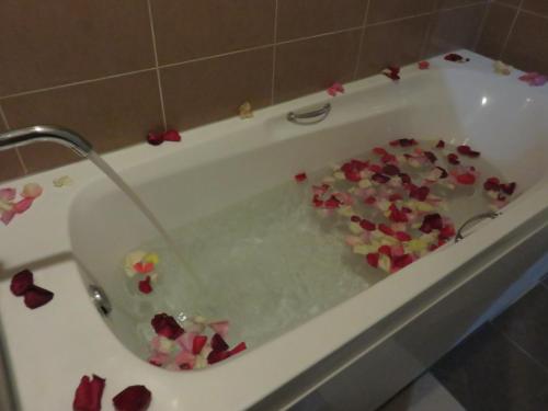 a bath tub filled with lots of broken hearts at RHR Hotel Kajang in Kajang