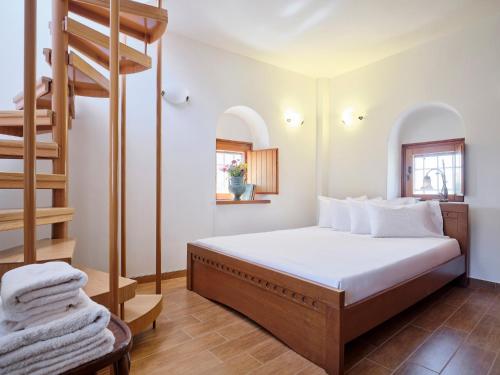 a bedroom with a bunk bed and a ladder at Petreas Castle in Kardamili