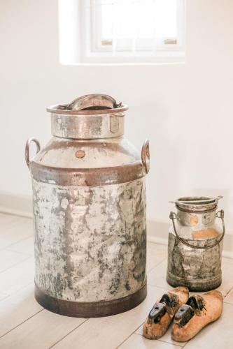 an old tin on a table with some cookies at River Bend Guesthouses in Graaff-Reinet