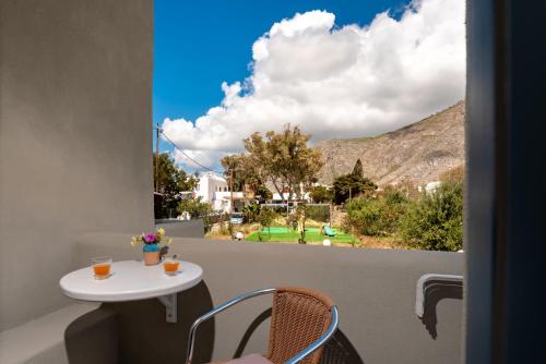 a view from a balcony with a table and chairs at Fortuna Perissa in Perissa