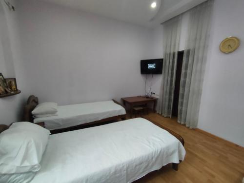 Ένα ή περισσότερα κρεβάτια σε δωμάτιο στο Guest House Nadejda