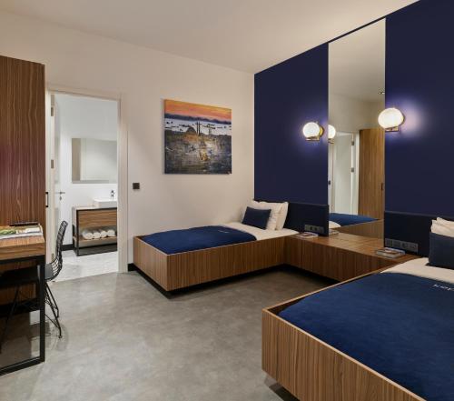 Кровать или кровати в номере Kepler Club Sabiha Gökçen Airport - International Transit Area