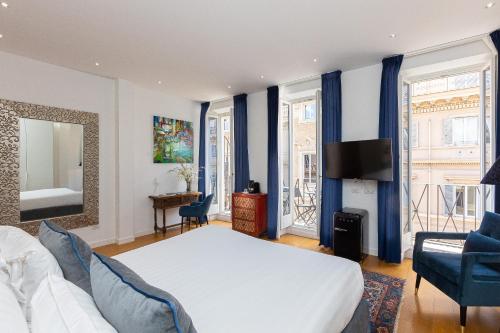 A bed or beds in a room at Suite della Pigna