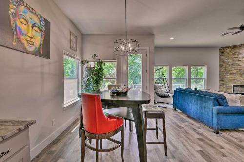 a living room with a table and a blue couch at Newly Constructed Mansfield Home with Fenced Yard! in Mansfield