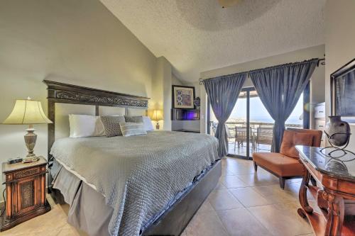 a bedroom with a bed and a desk and a table at Resort-Style Cabo Getaway with Pools & Ocean Views in Cabo San Lucas