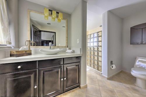 a bathroom with a sink and a toilet at Resort-Style Cabo Getaway with Pools & Ocean Views in Cabo San Lucas