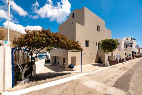 a street in a town with white buildings at Fortuna Perissa in Perissa