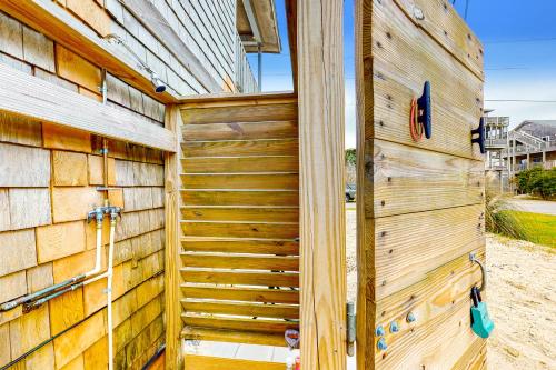 a wooden retaining wall next to a wooden building at Sea Shanty 960 in Hatteras