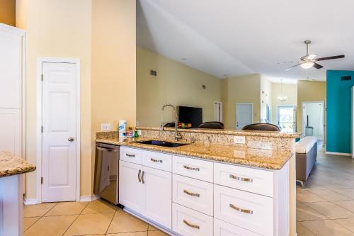 a kitchen with a sink and a counter top at Happy Home in Perdido Key