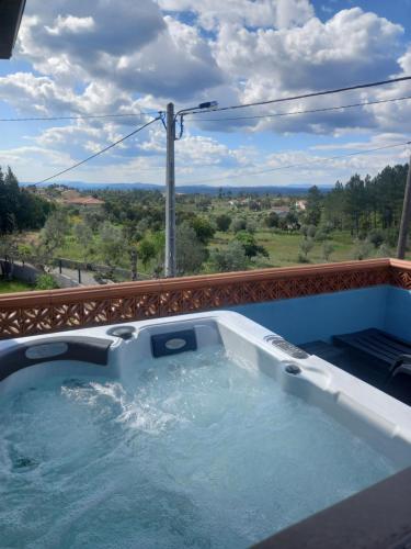 a hot tub on a balcony with a view at Regina in Peso