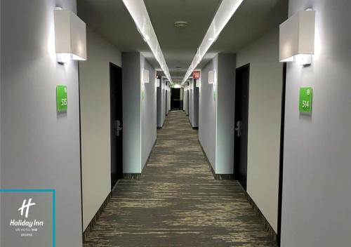 a hallway in a hospital with a long corridor at Holiday Inn Uruapan by IHG in Uruapan del Progreso