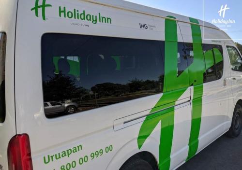 a white van with green graphics on the side at Holiday Inn Uruapan by IHG in Uruapan del Progreso
