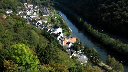 an aerial view of a village next to a river at Pension & Seminarhaus "Haus am Fluss" in Laurenburg