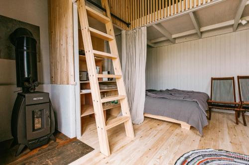 A bed or beds in a room at Pazust Latgalē Country Houses