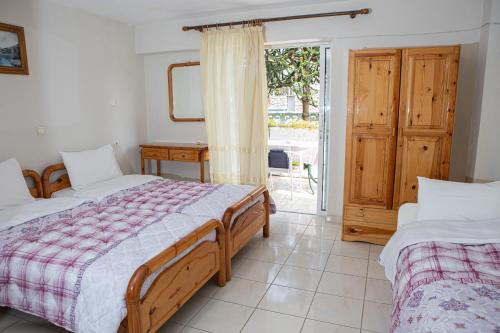 Postel nebo postele na pokoji v ubytování Ronzi Apartments