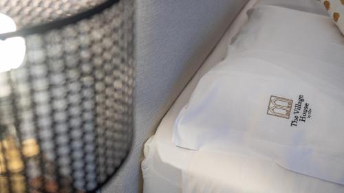 a close up of a pillow on a bed at The Village House by CDV in Carrazeda de Anciães