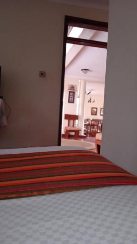 a bedroom with a large bed with a large window at dreamplace Gigiri in Nairobi