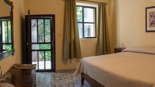 Cama o camas de una habitación en Hotel Rancho El Morillo