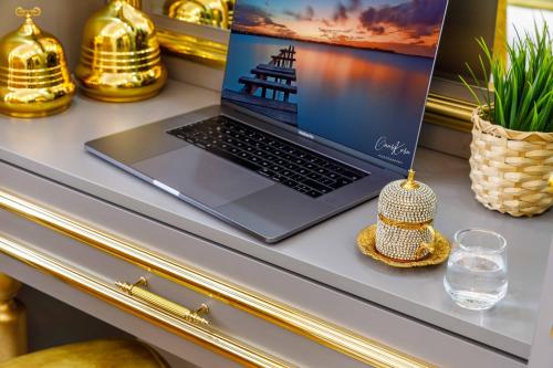 a laptop computer sitting on top of a desk at Santa Rio Taxim in Istanbul