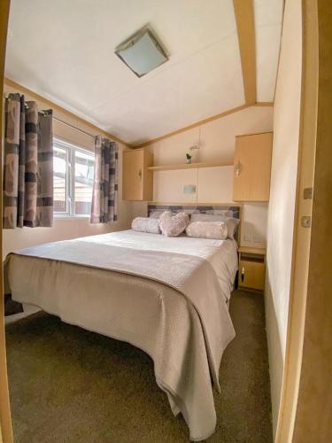a bedroom with a large bed in a room at Ruddingwood Lodge in Tuxford