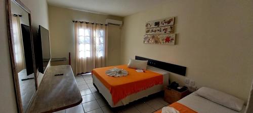 Postel nebo postele na pokoji v ubytování Hotel Recanto Do Sol