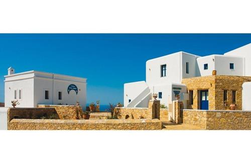 a group of white buildings with the sky in the background at Pegados Villas in Chora Folegandros