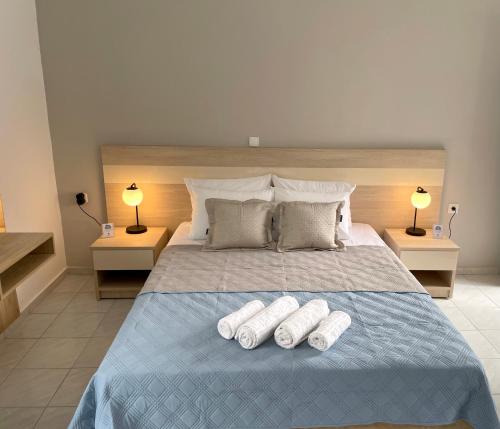 a bedroom with a bed with two pillows on it at Stelios Studios Sougia in Sougia