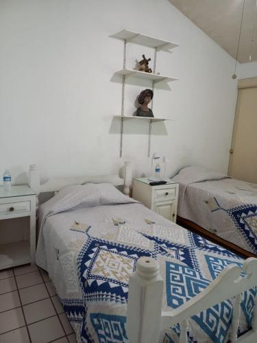 Cama o camas de una habitación en LA PEQUEÑA CASA BLANCA