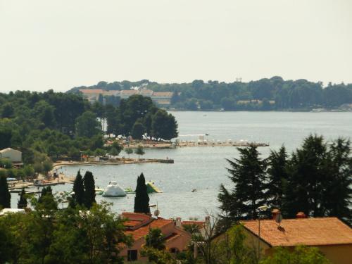 a view of a body of water with boats in it at Ulika Rooms & Apartments in Poreč