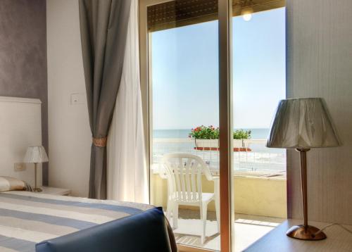 Postel nebo postele na pokoji v ubytování Hotel Telenia