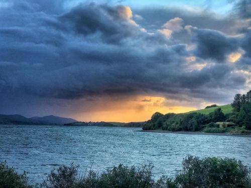 a view of a river with a cloudy sky at Niblick in Bantry