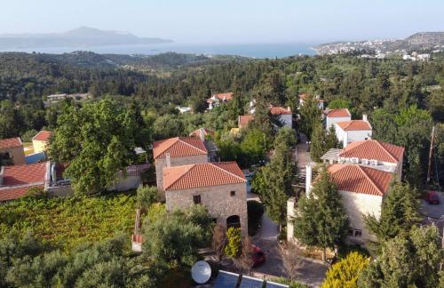 an aerial view of a village with houses and trees at Retreat Homes Apokoronas in Douliana