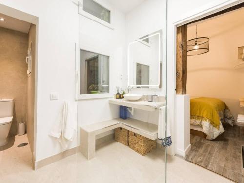 a bathroom with a sink and a mirror at Luxury Design Madrid Center in Madrid