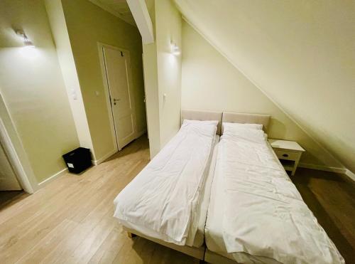 Posteľ alebo postele v izbe v ubytovaní Apartamenty - Dom w Ogrodzie Anny