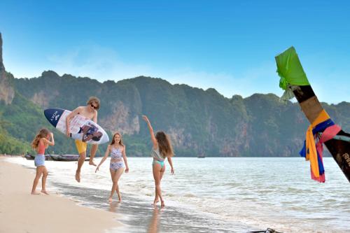 a group of children playing on the beach at COSI Krabi Ao Nang Beach - SHA Plus in Ao Nang Beach