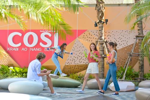 a group of people playing in an amusement park at COSI Krabi Ao Nang Beach - SHA Plus in Ao Nang Beach